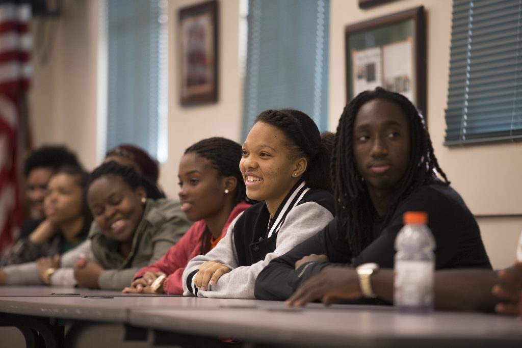 Students sitting and watching to a presentation